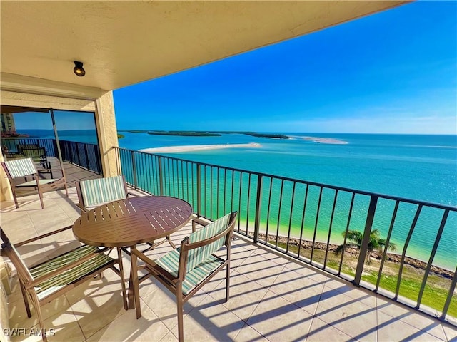 balcony featuring a water view