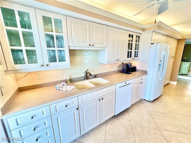 kitchen with sink, crown molding, white appliances, decorative backsplash, and light tile patterned floors