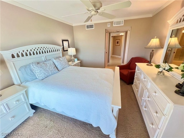 carpeted bedroom with ceiling fan and crown molding