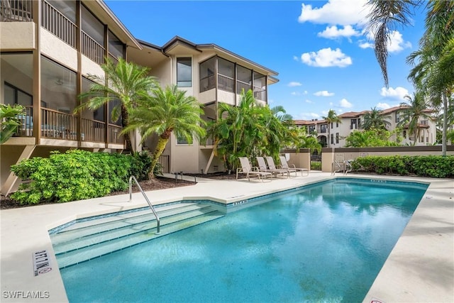 view of pool featuring a patio