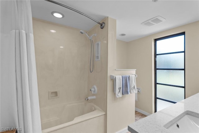 bathroom featuring shower / tub combo with curtain and vanity