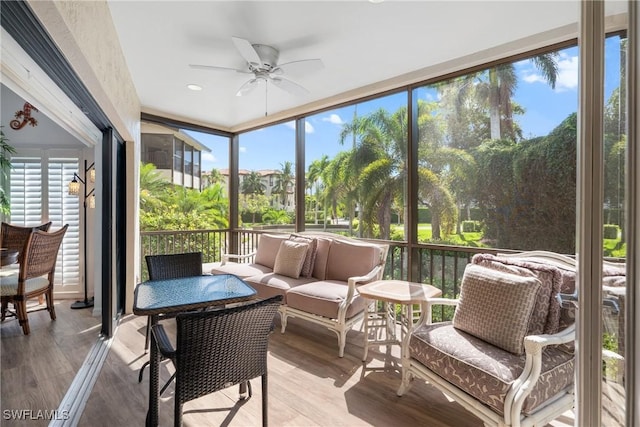 sunroom featuring ceiling fan