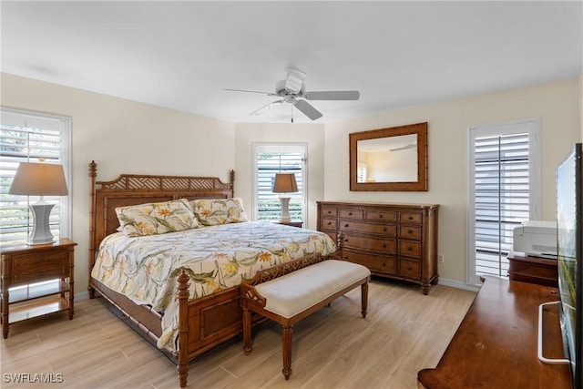 bedroom with ceiling fan and light wood-type flooring