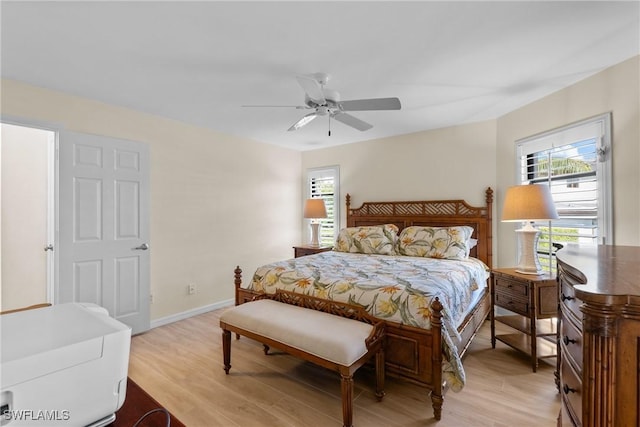 bedroom featuring light hardwood / wood-style floors and ceiling fan