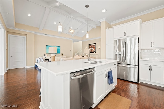 kitchen with lofted ceiling with beams, stainless steel appliances, white cabinetry, ceiling fan, and a kitchen island with sink