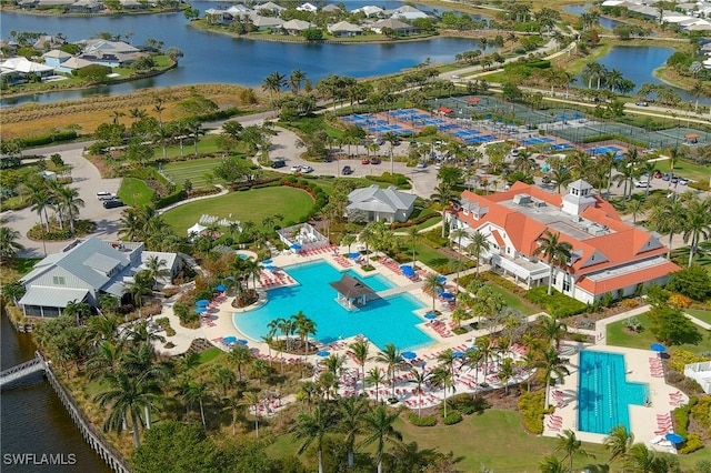 birds eye view of property with a water view