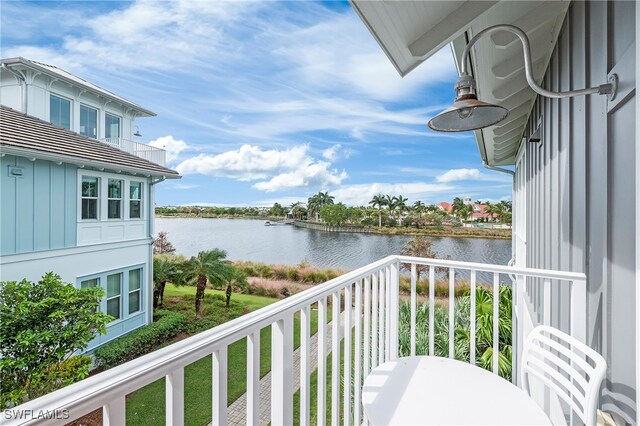 balcony featuring a water view