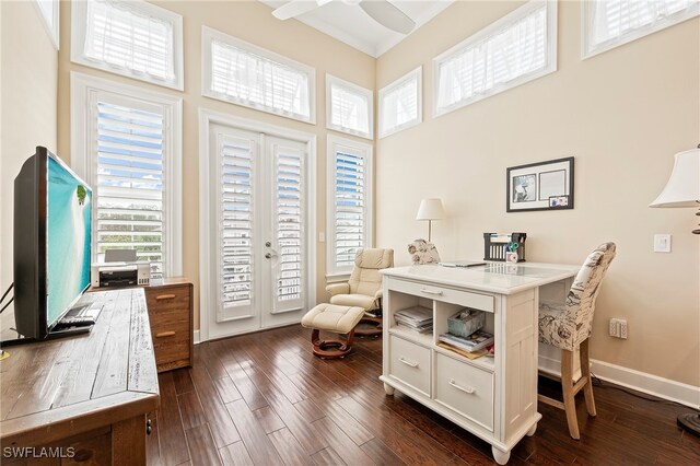 office with dark wood-type flooring, ceiling fan, and a high ceiling