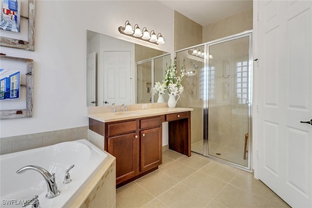 bathroom featuring tile patterned flooring, vanity, and shower with separate bathtub