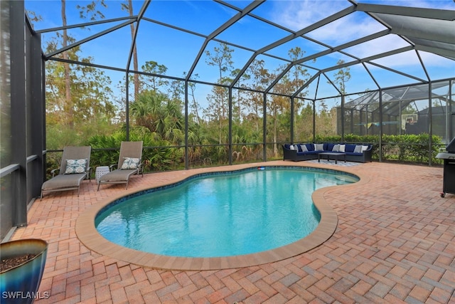 view of pool featuring a lanai, a patio, and an outdoor hangout area