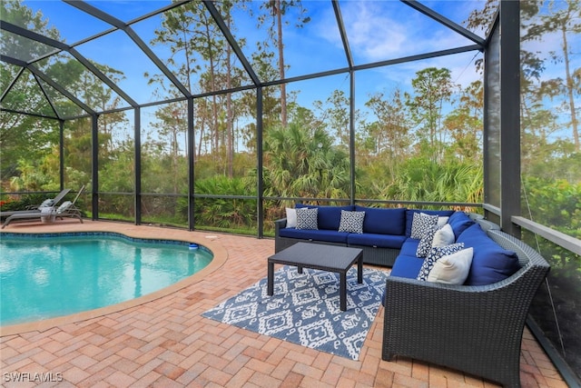 view of swimming pool featuring a lanai, an outdoor hangout area, and a patio