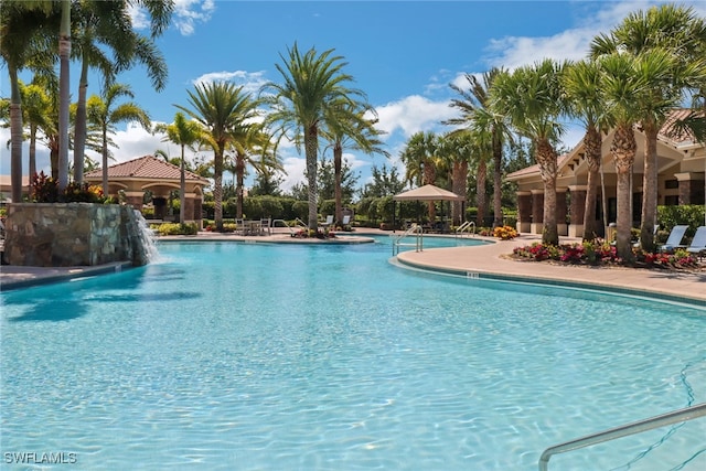 view of swimming pool featuring pool water feature