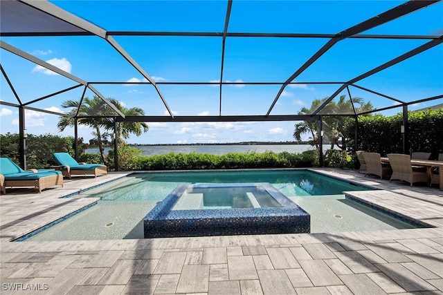 view of pool with a lanai, an in ground hot tub, a water view, and a patio