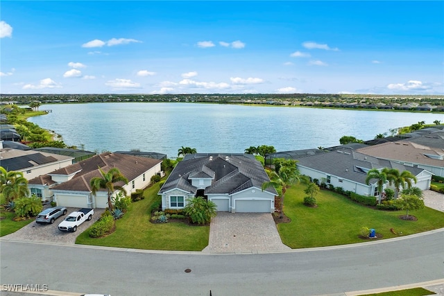 birds eye view of property with a water view