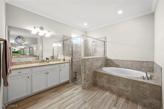 bathroom with separate shower and tub, vanity, wood-type flooring, and ornamental molding