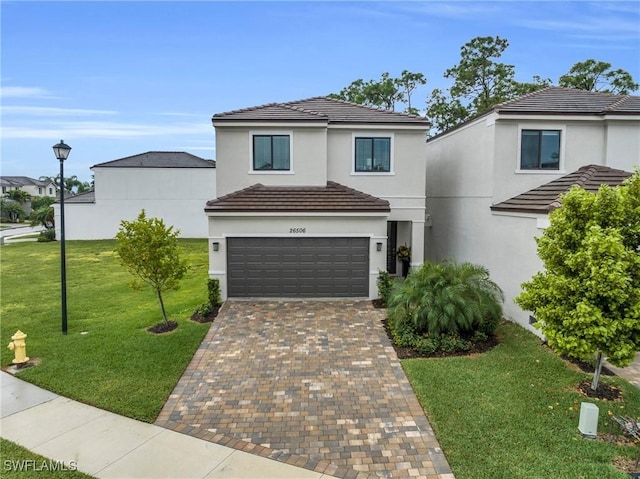 traditional-style home with stucco siding, a front lawn, a tile roof, decorative driveway, and a garage