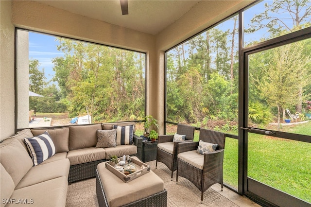 sunroom featuring ceiling fan