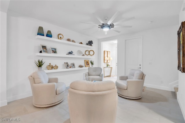 sitting room featuring ceiling fan and light tile patterned floors