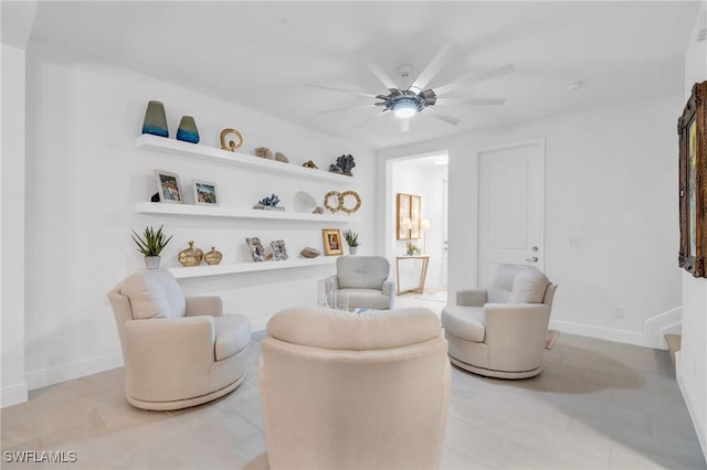26506 Bonita Fairways Blvd, Bonita Springs, FL 34135 - sitting room with ceiling fan, light tile patterned floors, and baseboards