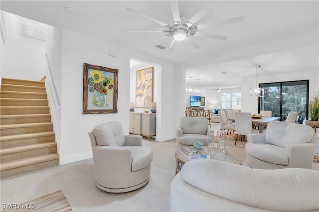 tiled living room featuring ceiling fan