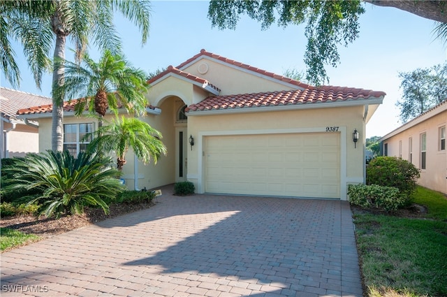 mediterranean / spanish-style home featuring a garage