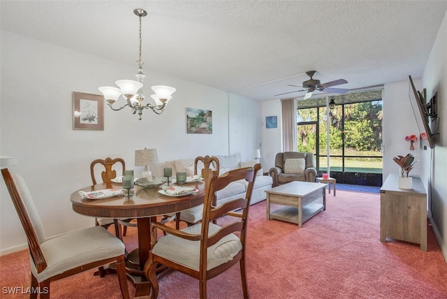 carpeted dining room with ceiling fan with notable chandelier and a textured ceiling