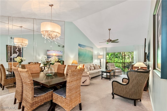 carpeted dining space with ceiling fan with notable chandelier and high vaulted ceiling