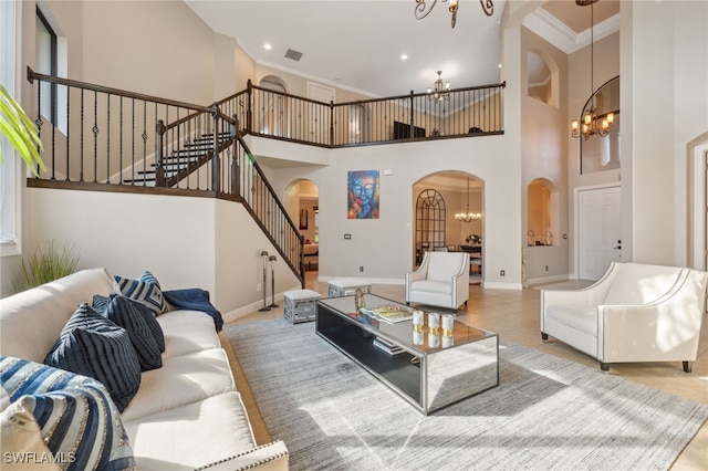 living room featuring crown molding, light tile patterned floors, a high ceiling, and an inviting chandelier