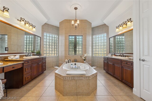 bathroom with tile patterned floors, tile walls, and an inviting chandelier