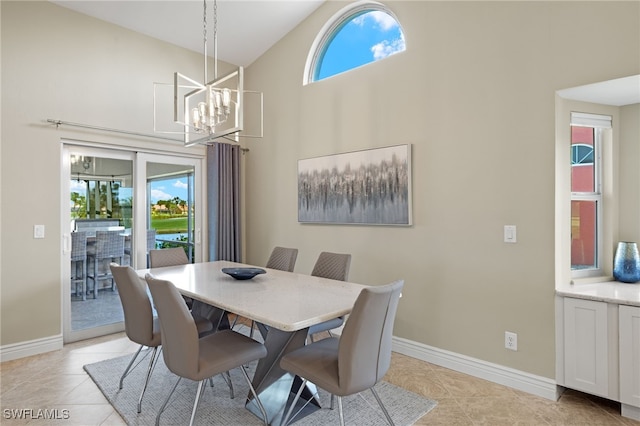 dining space with high vaulted ceiling, a wealth of natural light, baseboards, and light tile patterned floors