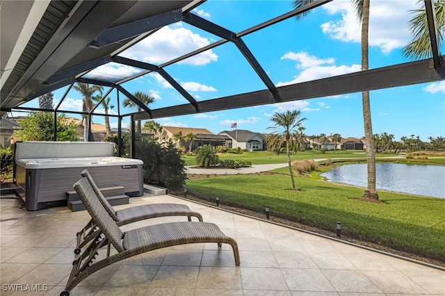 view of patio / terrace featuring a water view, glass enclosure, and a hot tub