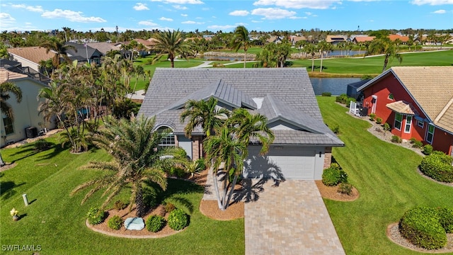 drone / aerial view with a water view and a residential view