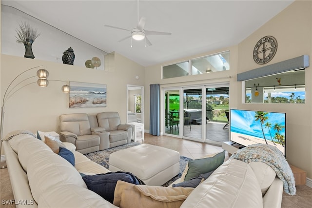 living room featuring high vaulted ceiling, tile patterned flooring, and a ceiling fan