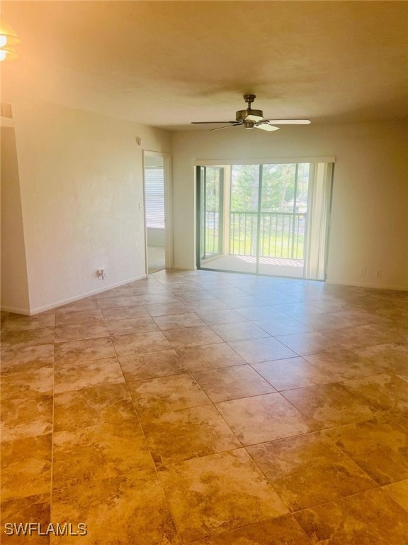 unfurnished room with a ceiling fan