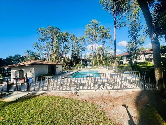 pool featuring a patio area and fence