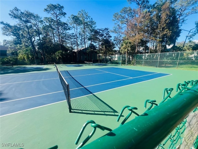 view of sport court featuring community basketball court and fence