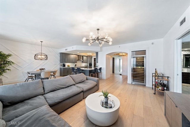 living room featuring light hardwood / wood-style flooring and wine cooler