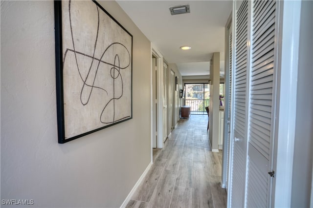 corridor featuring light wood-type flooring