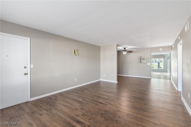 unfurnished living room featuring dark wood-type flooring