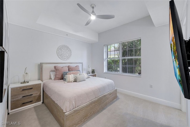 bedroom featuring light colored carpet and ceiling fan