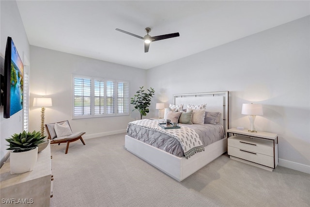 bedroom with ceiling fan and light colored carpet