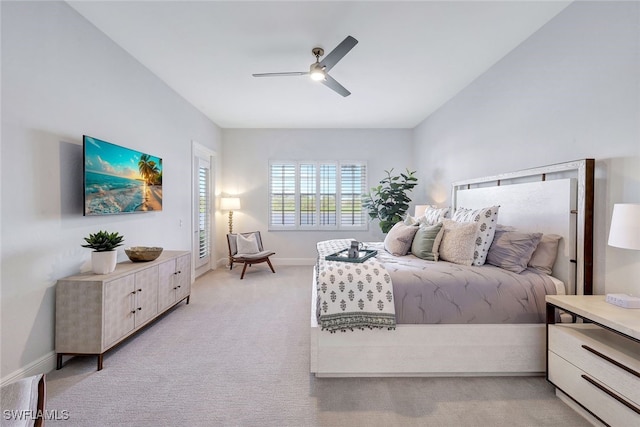 bedroom with light carpet and ceiling fan