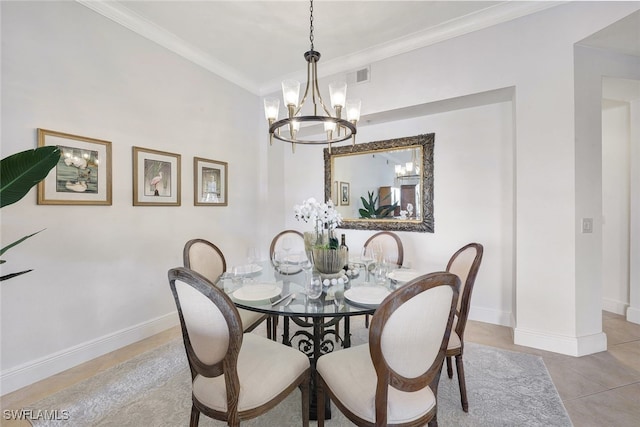 dining room featuring a notable chandelier, light tile patterned flooring, and ornamental molding