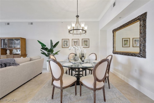 tiled dining room with crown molding and a chandelier