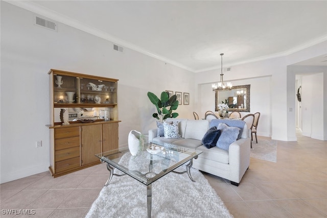 living room featuring ornamental molding, a chandelier, and light tile patterned floors