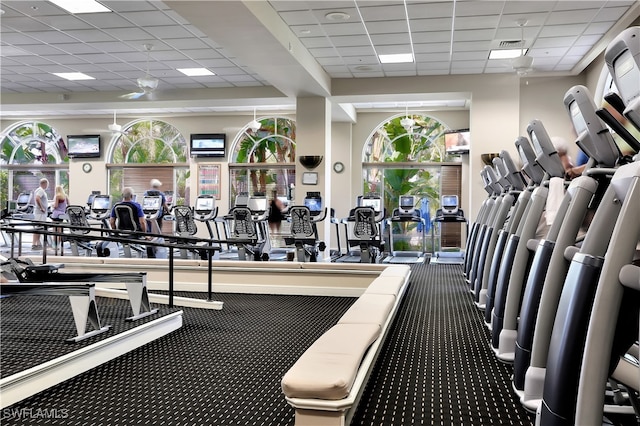 exercise room with a paneled ceiling