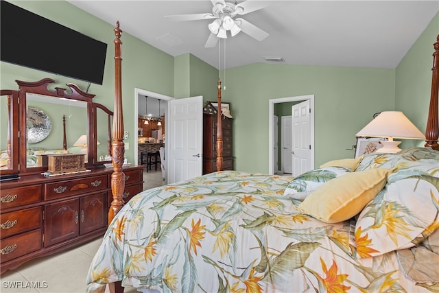 tiled bedroom with vaulted ceiling and ceiling fan