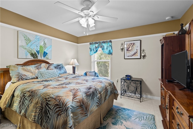 tiled bedroom with ceiling fan