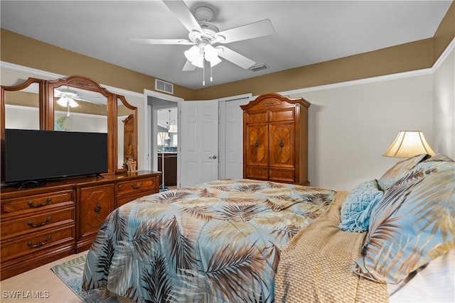 bedroom featuring ceiling fan and connected bathroom