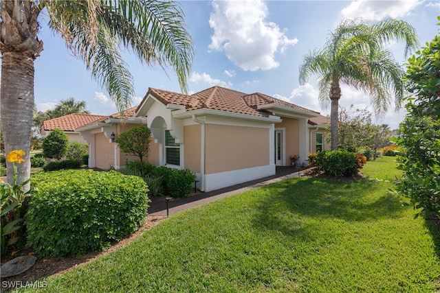 view of home's exterior featuring a yard and a garage